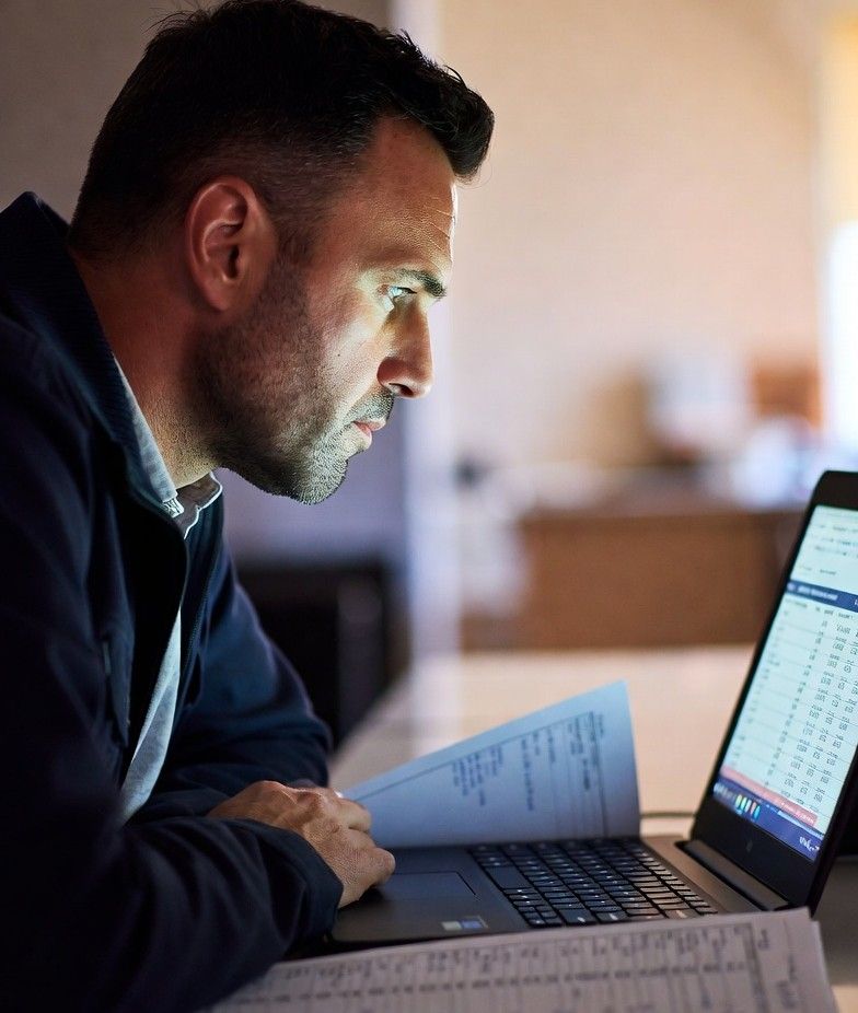 studying lottery results on a laptop